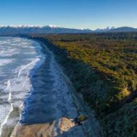 Aerial View of Blue Cliffs Beach and the start of the Hump Ridge Track | Videocopter