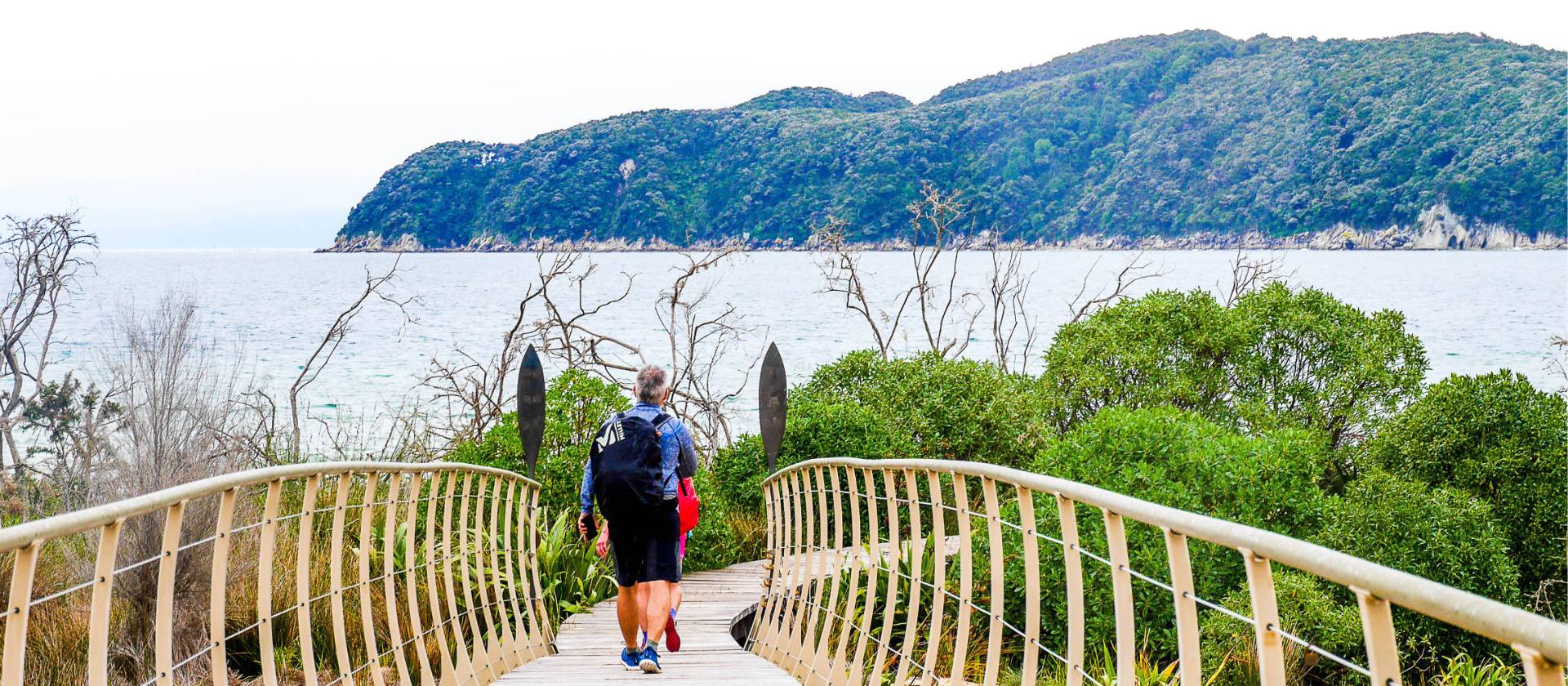 Walkers cross over bridges and walkways as part of the Abel Tasman Track | Natalie Tambolash