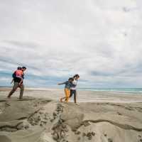 Walking along the sand dunes in Golden Bay. | Nelson Tasman Tourism