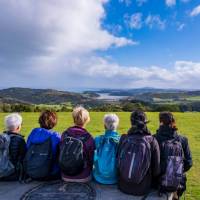 A group of Te Ara Hura walkers stop to take a break and admire the view | Gabrielle Young