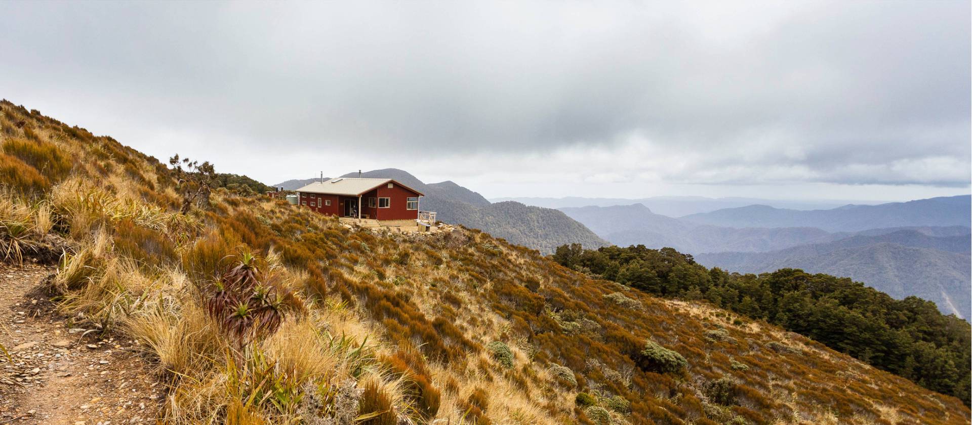 Moonlight Tops Hut with panoramic views across the Punakaiki River, Pike Stream and Paparoa National Park | Jase Blair (Tourism New Zealand)