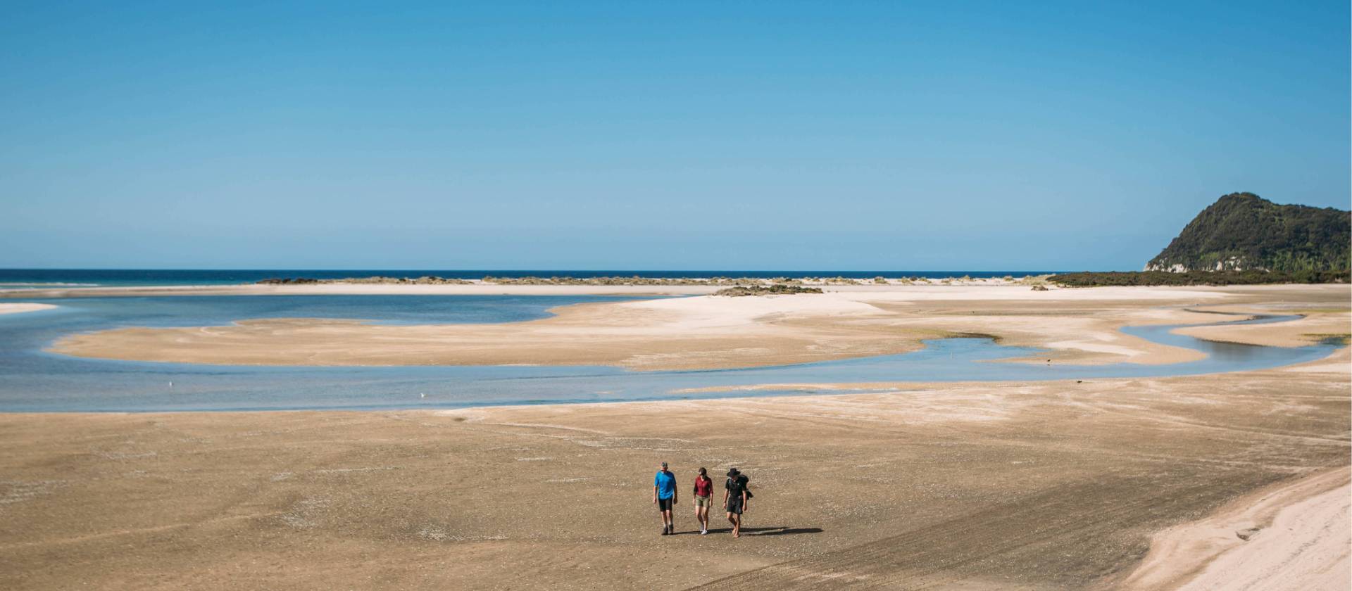 Walking Awaroa Beach at low tide | Nelson Tasman Tourism