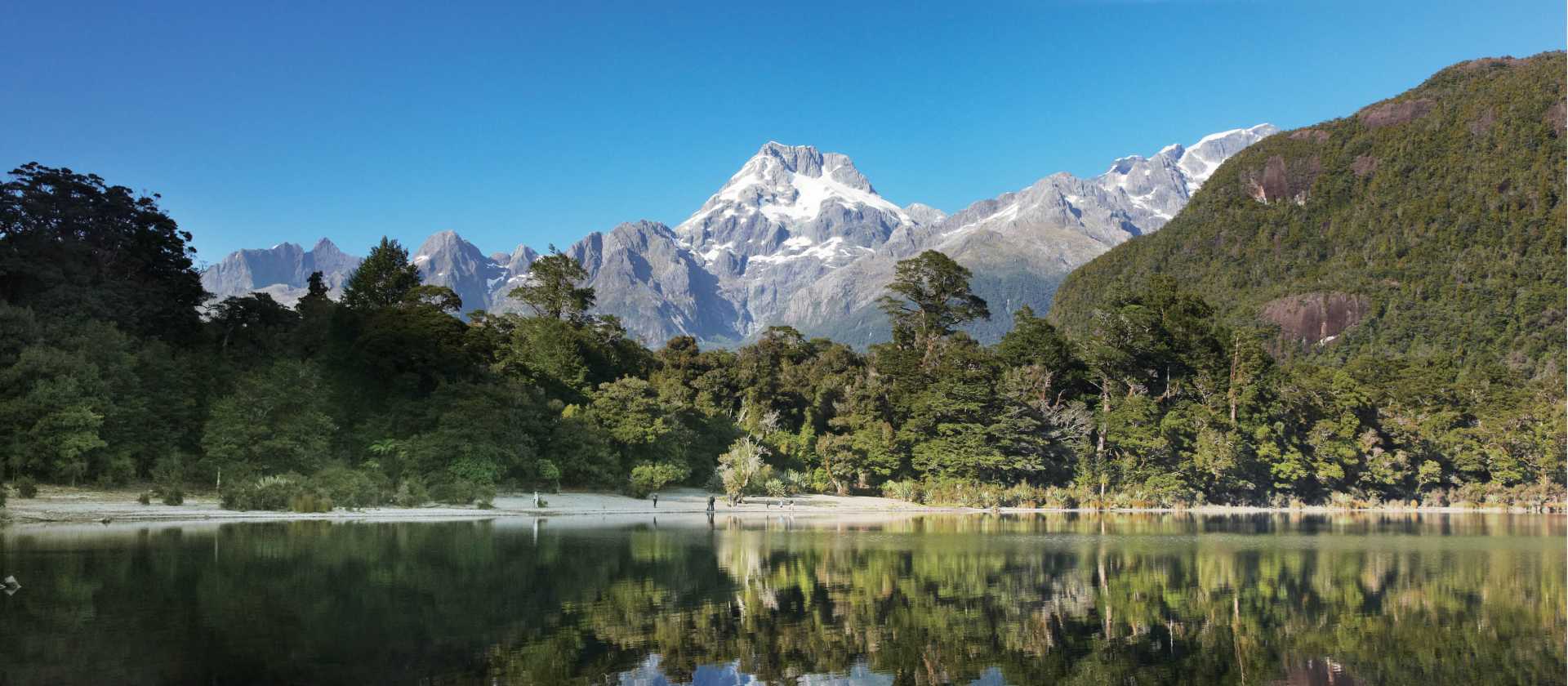 The still waters of Lake Alabaster, reflects Mt Madeline