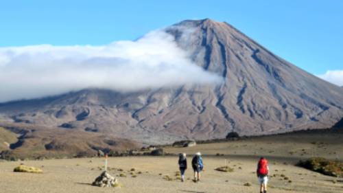 Walkers enjoying the barren lands of the Tongariro Alpine Crossing | David Tip