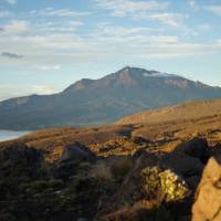 Looking out over the clouds at Mount Ruapehu from Mount Ngauruhoe on the Tongariro Northern Circuit | Zac M-W