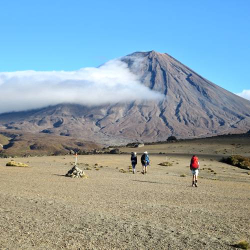 Walkers enjoying the barren lands of the Tongariro Alpine Crossing