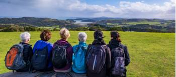 A group of Te Ara Hura walkers stop to take a break and admire the view | Gabrielle Young